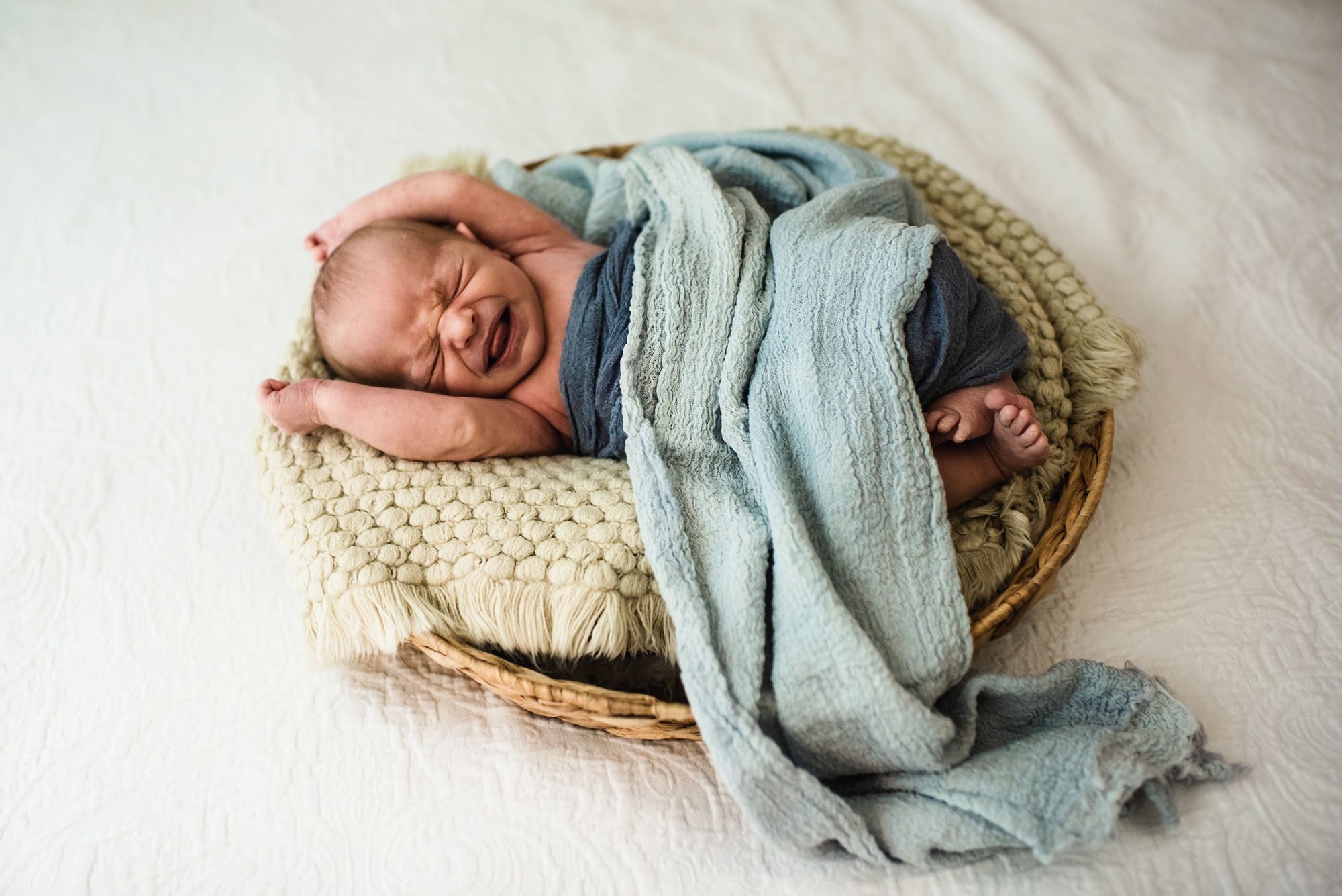 Baby boy crying in basket, San Antonio Newborn Photographer