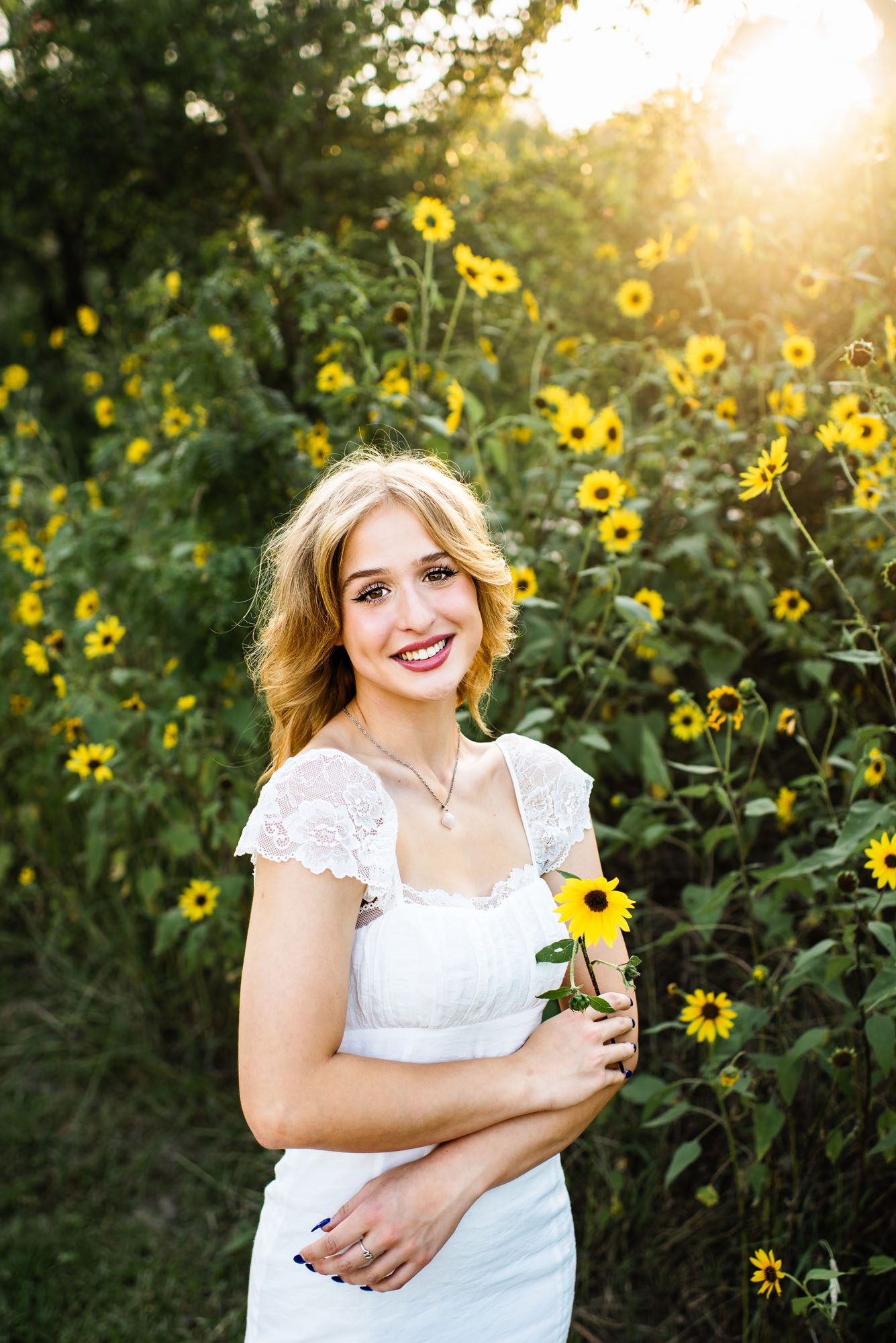 Girl standing by sunflower field, San Antonio senior photographer