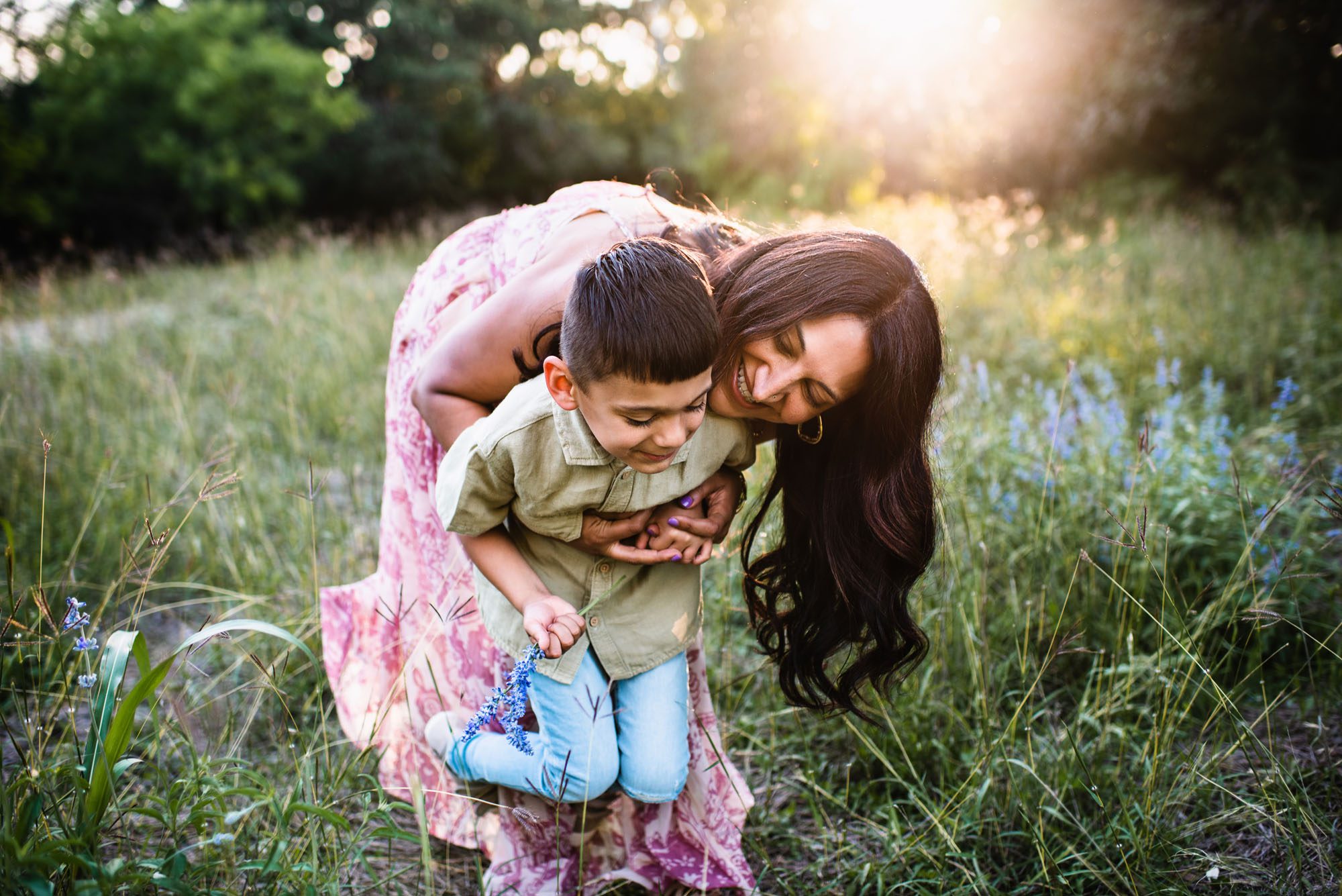 Mother and son playing in a filed at sunset, San Antonio family photographer