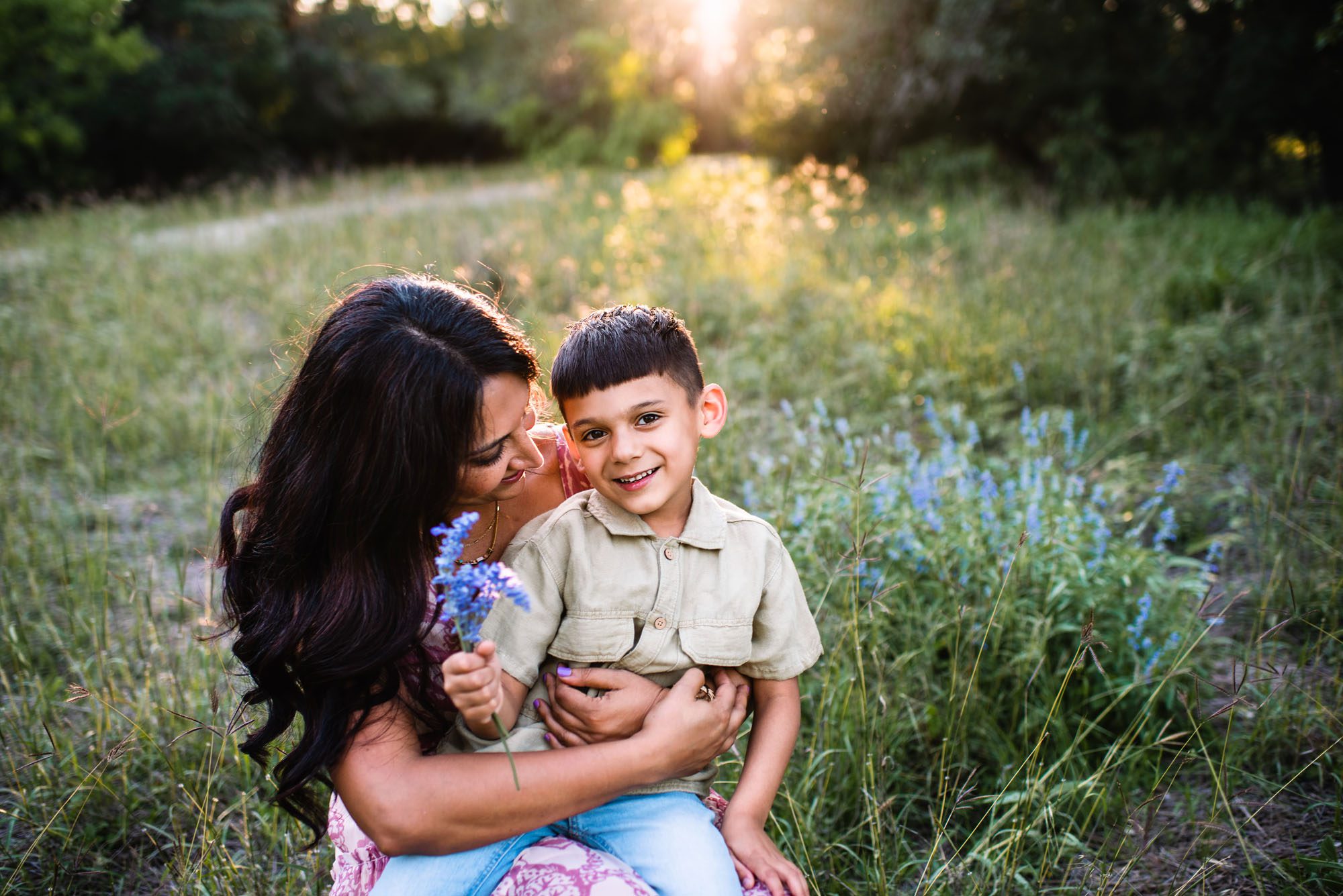 Mother and son sitting with wildflowers, San Antonio family photographer