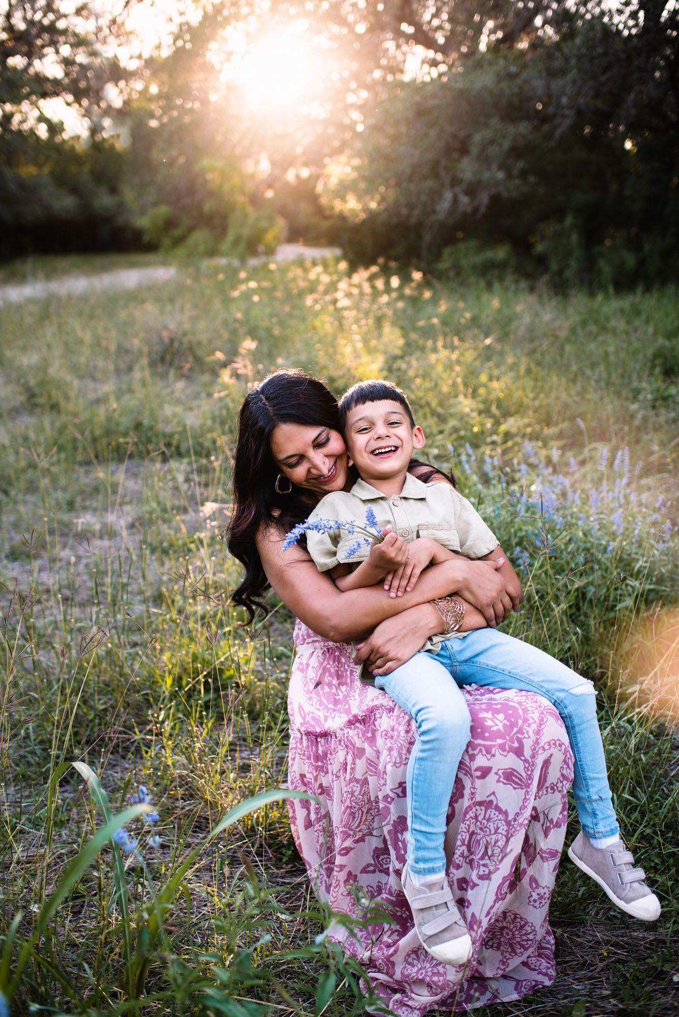 Mother and son sitting with wildflowers, best family photographer in San Antonio