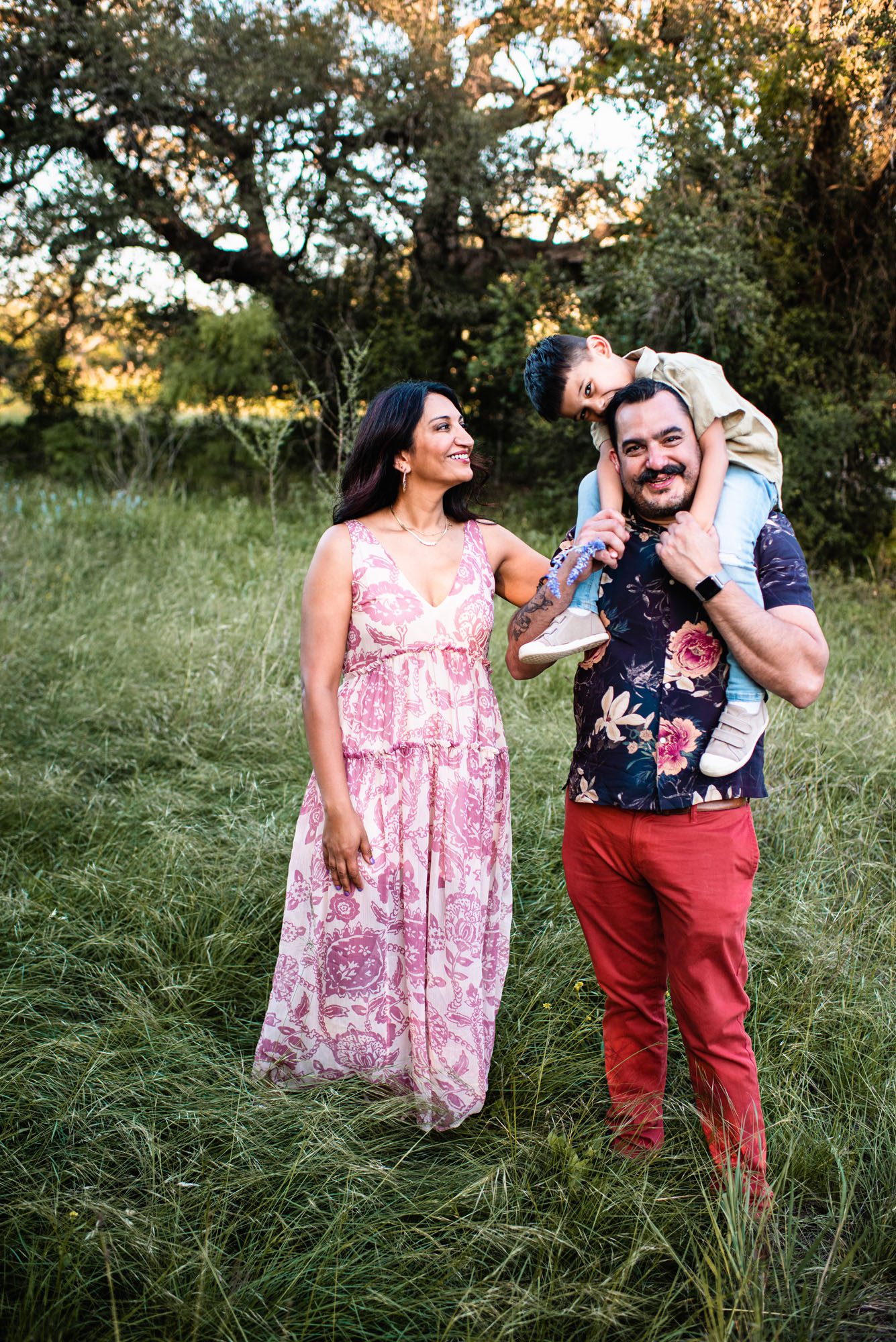 Family standing in grassy field, Family photographer in San Antonio