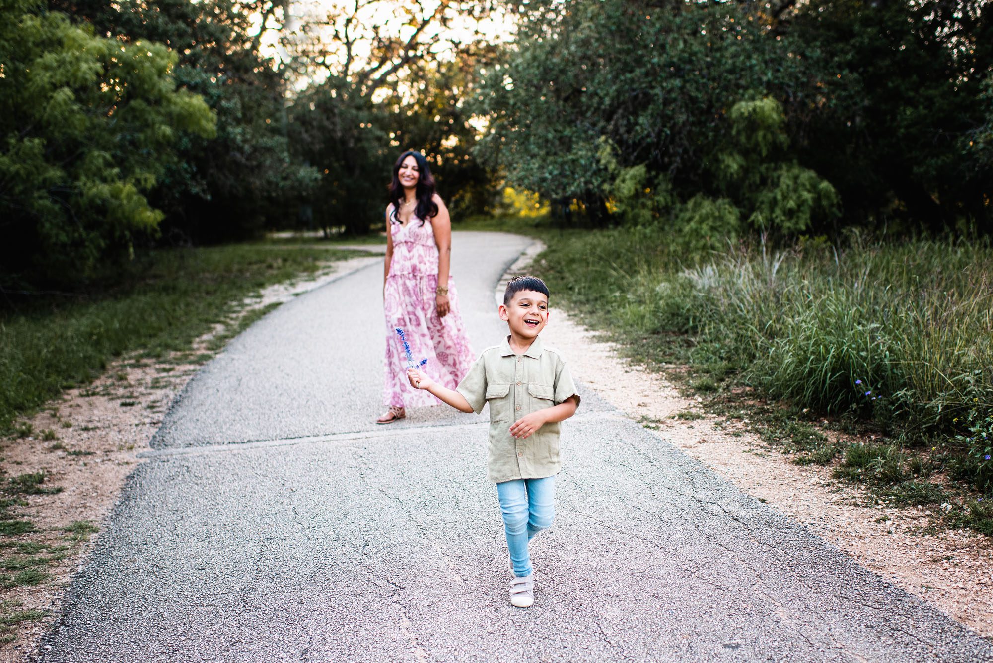 Mother and son walking along a path, San Antonio lifestyle family photographer