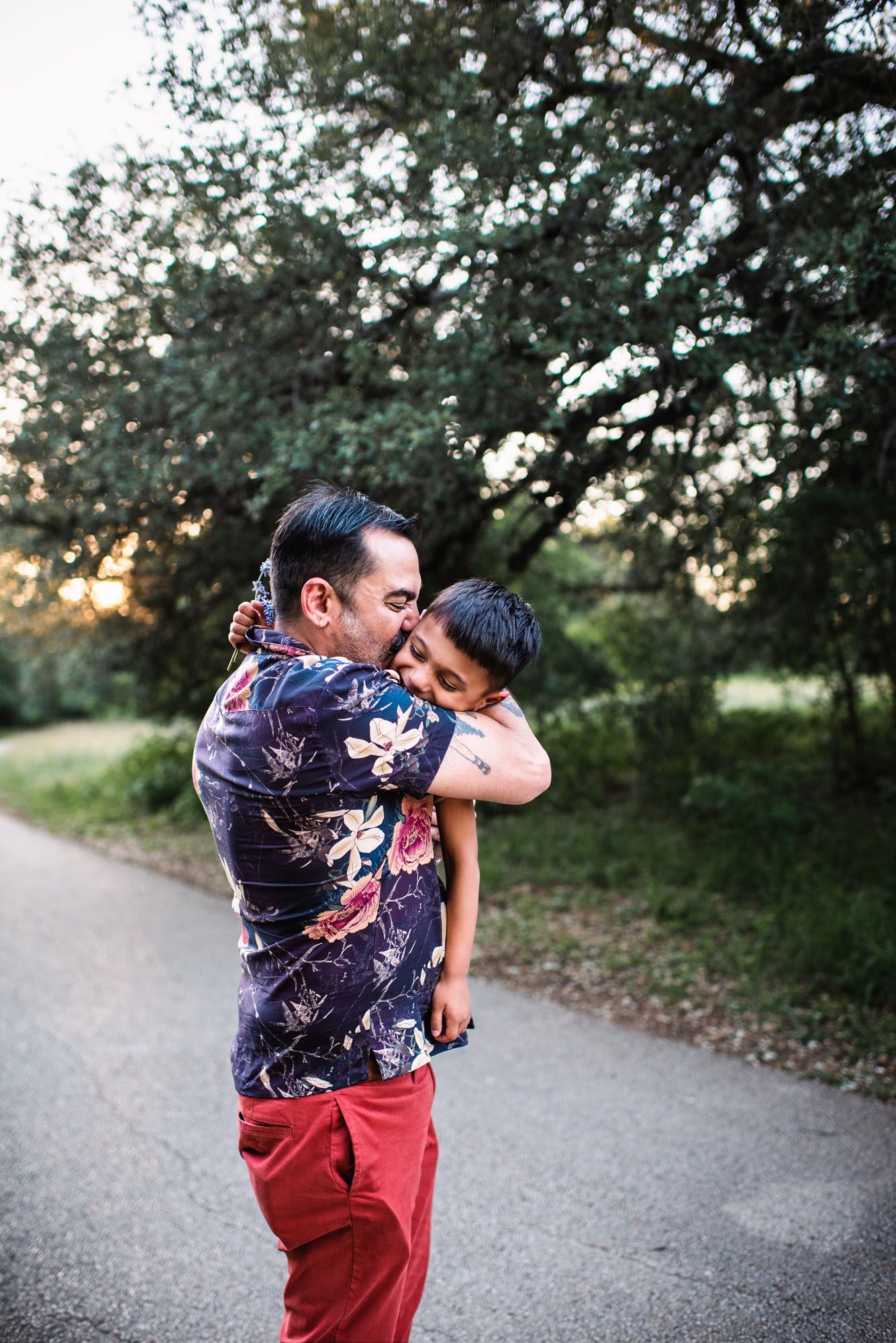 Father and son hugging in park, San Antonio family photographer