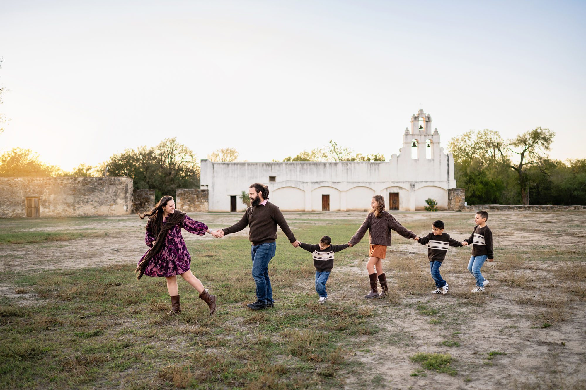 Family walking in front of Mission San Juan; San Antonio lifestyle photographer