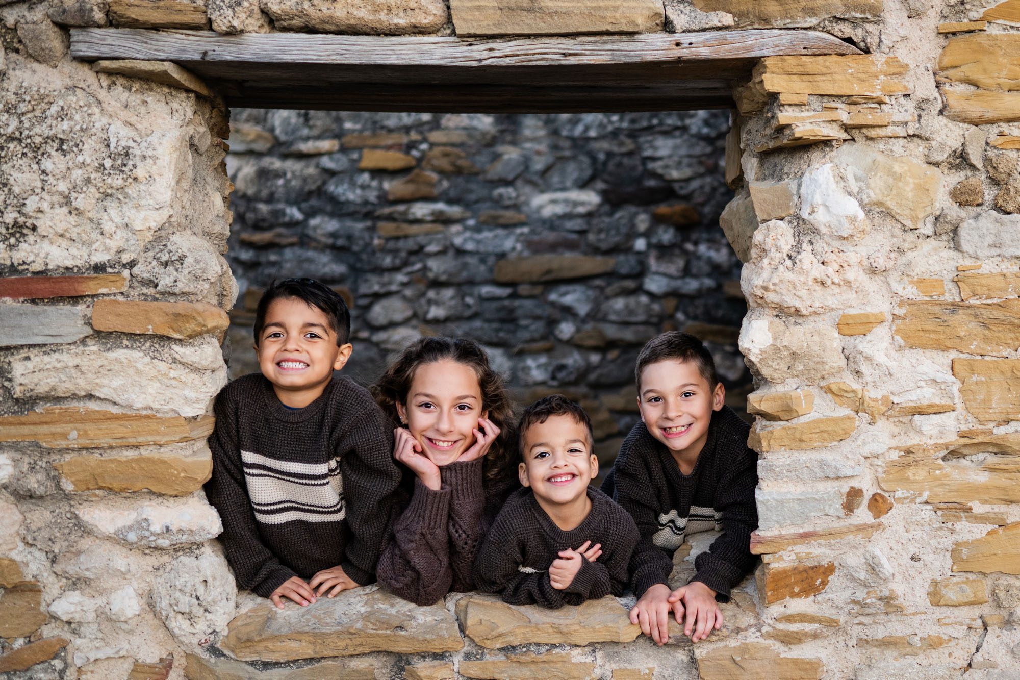 Four children in stone window; San Antonio family photographer