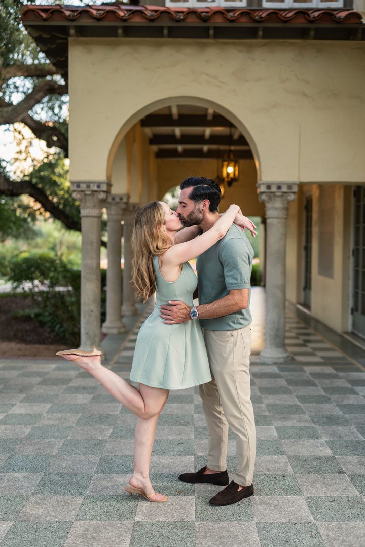 Couple kissing under archway, San Antonio family photographer